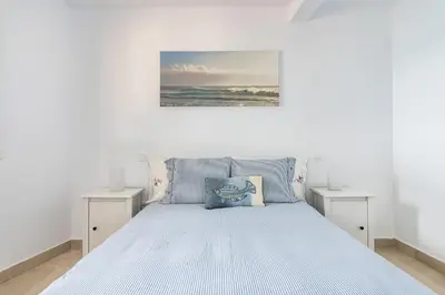 Cama o camas de una habitación en Casa Daura Playa de Arinaga Beach Front