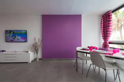 Una televisión o centro de entretenimiento en Apartamentos Karma