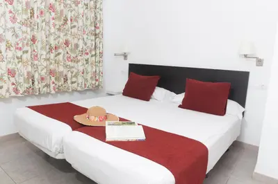 Cama o camas de una habitación en Alsol Mariachis