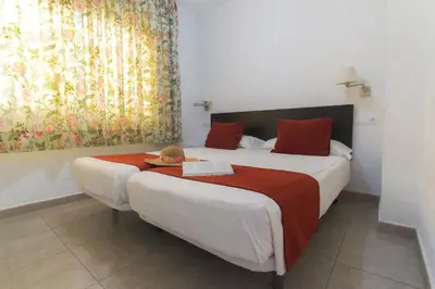 Cama o camas de una habitación en Alsol Mariachis