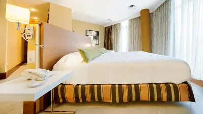 Cama o camas de una habitación en Bull Astoria
