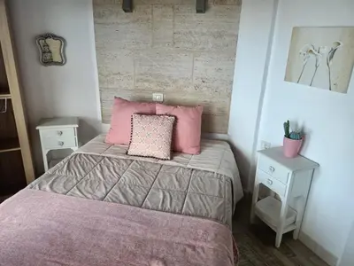 Cama o camas de una habitación en La Casita De Juani