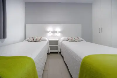 Cama o camas de una habitación en ConMar