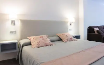 Cama o camas de una habitación en Apartamentos El Palmar