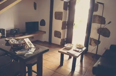 Una televisión o centro de entretenimiento en Vivelorural casa Tunte 3, BBQ y terraza