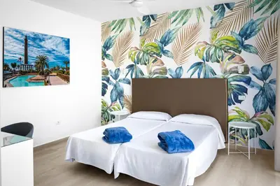 Cama o camas de una habitación en Hotel Valencia