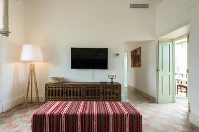 Una televisión o centro de entretenimiento en Villa Hacienda de la Guirra