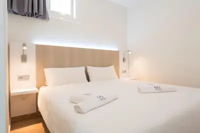 Cama o camas de una habitación en eó Las Rosas