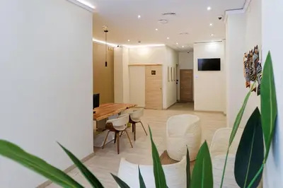 Una televisión o centro de entretenimiento en Ura Hotels Boutique Gurea