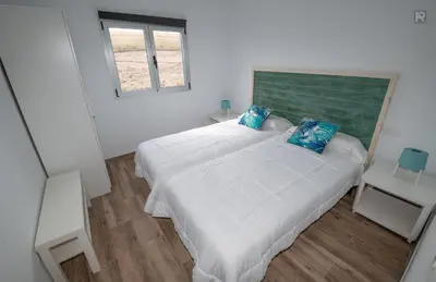 Cama o camas de una habitación en Casa Playa Ondina