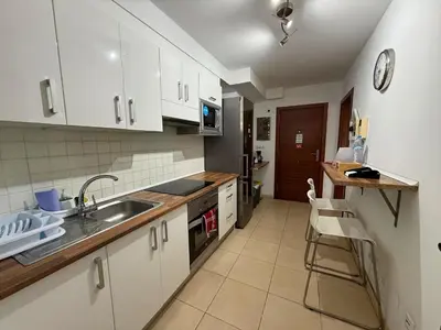 Una cocina o zona de cocina en Apartamento Muelle Deportivo