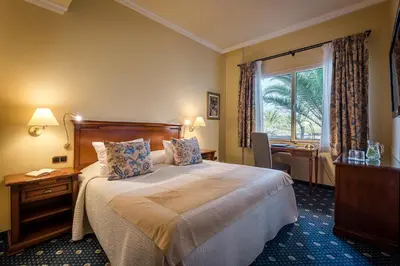 Cama o camas de una habitación en Casa León Royal Retreat