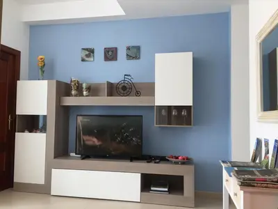 Una televisión o centro de entretenimiento en Ikigai Las Canteras