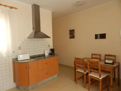 Una cocina o zona de cocina en Trotamundos GC FAMILIAS Y ADULTOS RESPONSABLES
