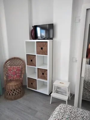 Una televisión o centro de entretenimiento en Apartamento Toñi