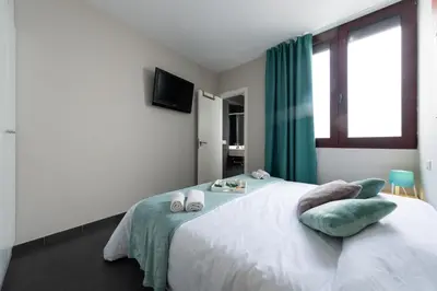 Cama o camas de una habitación en Living Las Canteras Homes - LAS CANTERAS PENTHOUSE