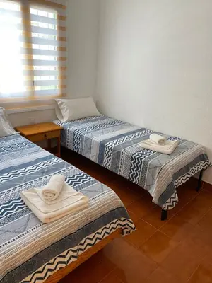 Cama o camas de una habitación en Casa de 5 dormitorios y 2 terrazas
