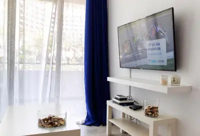 Una televisión o centro de entretenimiento en Prosurfing Apartamento