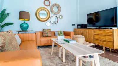 Una televisión o centro de entretenimiento en Salobre Golf Villas Premium
