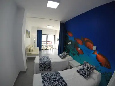 Cama o camas de una habitación en Apartamentos Juan Pérez- Viviendas Vacacionales