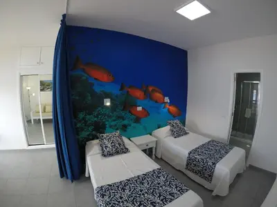 Cama o camas de una habitación en Apartamentos Juan Pérez- Viviendas Vacacionales