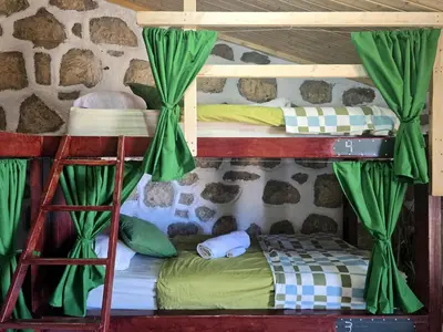Cama o camas de una habitación en Mountain Hostel&House Finca La Isa by Rose
