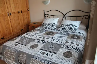 Cama o camas de una habitación en Bungalow Duna Flor Verde