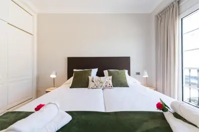 Cama o camas de una habitación en Sunny Sky Apartment