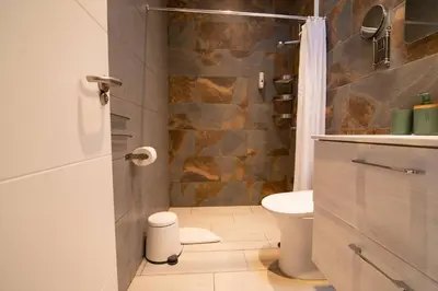 Un baño de Costa Lairaga Suite. Beachfront! Air conditioned