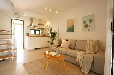 Zona de estar de Maspalomas Suite by 