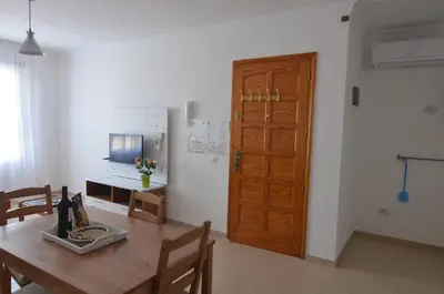 Una televisión o centro de entretenimiento en Armonía Beach 104