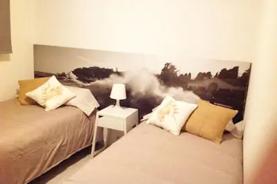Cama o camas de una habitación en Apartamento en Playa de las Burras