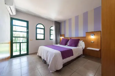 Cama o camas de una habitación en eó Maspalomas Resort