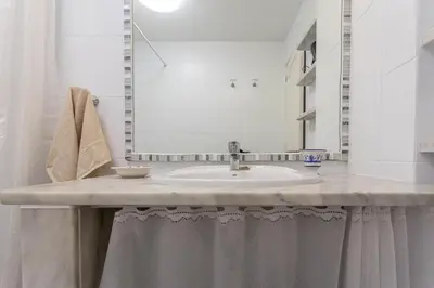 Un baño de Apartment with Terrace on the Beachfront.