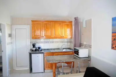 Una cocina o zona de cocina en Bungalows Los Arcos