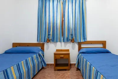 Cama o camas de una habitación en Ura Hotels Apartamentos Montecarlo