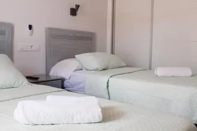 Cama o camas de una habitación en bonito apartamento 109 by CASAS COCODRILO