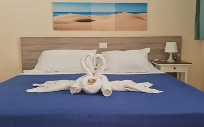 Cama o camas de una habitación en Apartamentos Strelitzias
