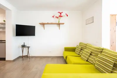 Una televisión o centro de entretenimiento en Casa Avenida del Agujero