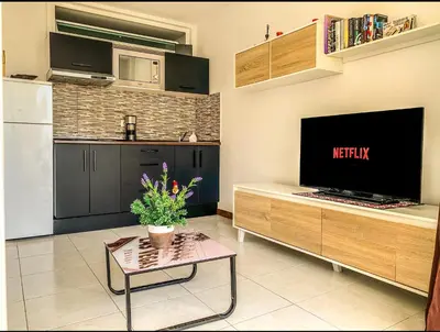 Una televisión o centro de entretenimiento en Apartamento Luxury