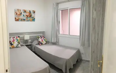 Cama o camas de una habitación en Billy's Las Rocas Apt Playa de Mogan with pool access