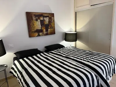 Cama o camas de una habitación en Beach line apartment