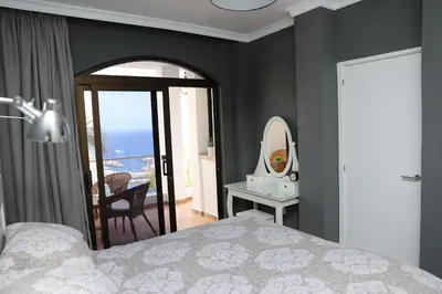 Cama o camas de una habitación en Avenida de la Cornisa 11