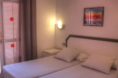 Cama o camas de una habitación en Bungalows Los Melocotones