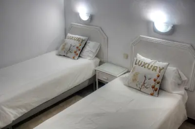 Cama o camas de una habitación en Bungalows Los Melocotones