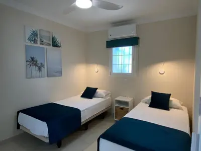Cama o camas de una habitación en Bungalows Granada Beach