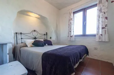 Cama o camas de una habitación en Casa Cueva El Caidero By Artenatur