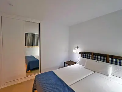 Cama o camas de una habitación en Apartamentos Portonovo