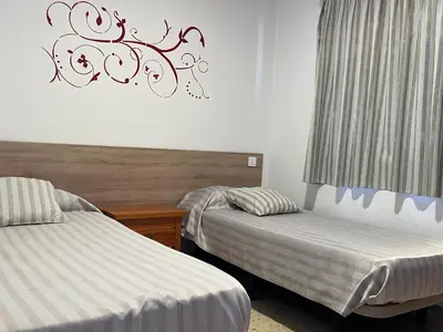 Cama o camas de una habitación en Apartamentos Buenavista