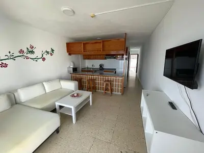Una televisión o centro de entretenimiento en Apartamentos Buenavista